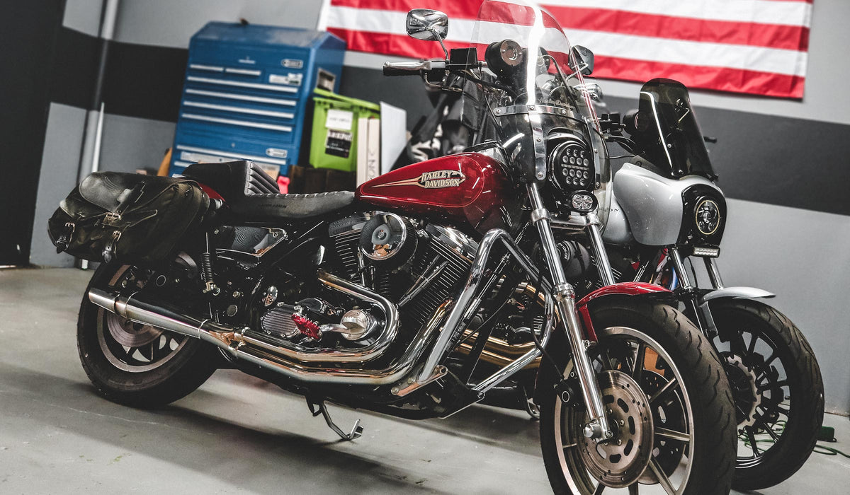 Red and silver Harley-Davidson motorcycles in the MOONSMC garage