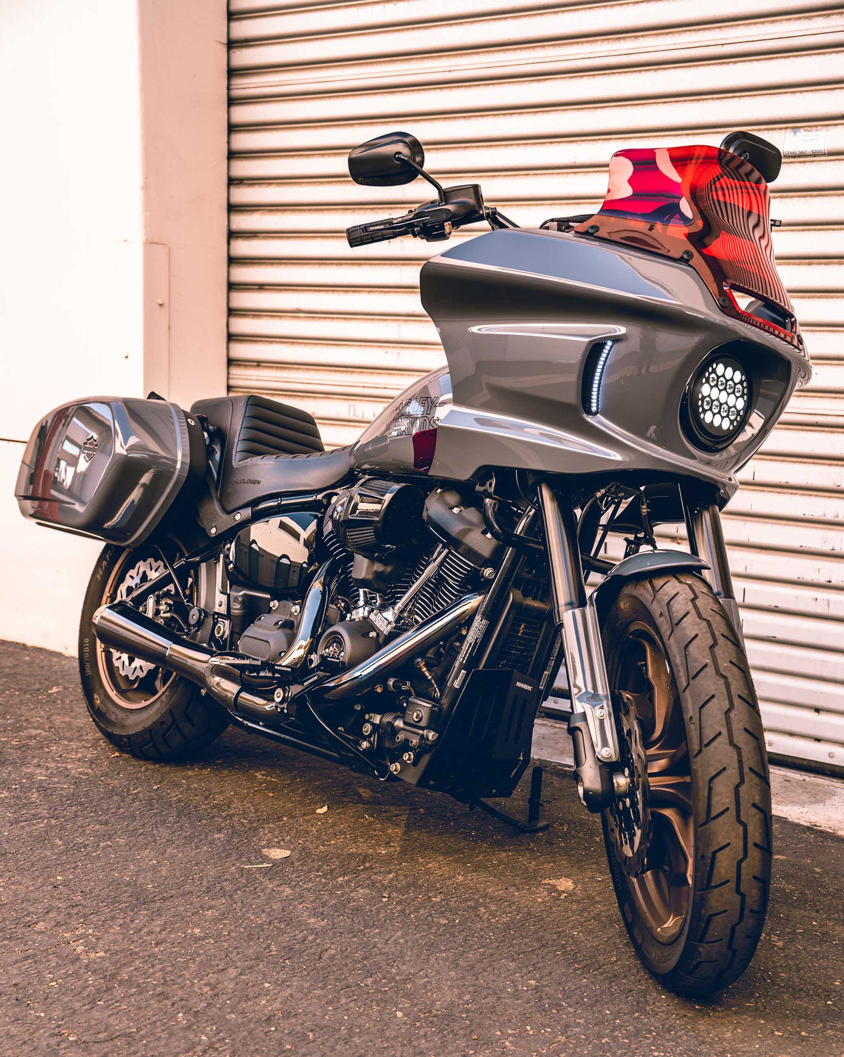 MOONSMC lighting fitted to a gray Softail motorcycle