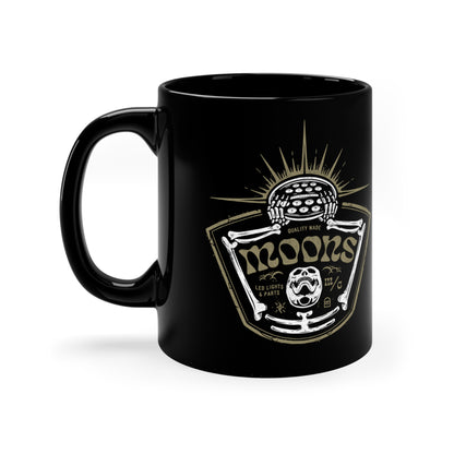 MOONSMC Skeleton - Rise of the Fly Eye 11oz Black Mug: black mug showing the skeleton and headlight graphic, handle on the left.