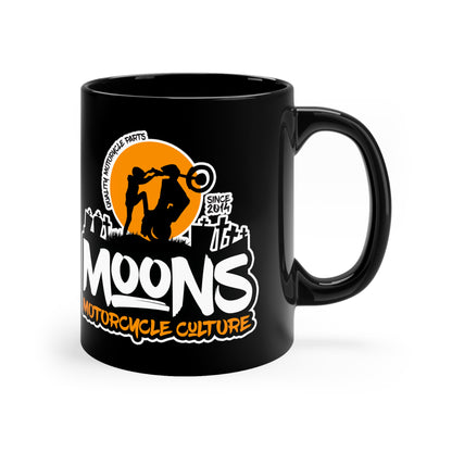 MOONSMC Dyna Graveyard Wheelie 11oz Black Mug: black mug showing the orange moon and wheelie graphic, handle on the right.