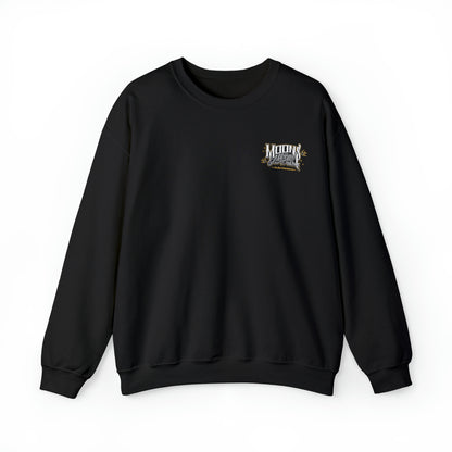 MOONSMC San Juan Capistrano, Ca. Logo Heavy Blend Crewneck Sweatshirt: front of the black sweatshirt with a small chest logo.