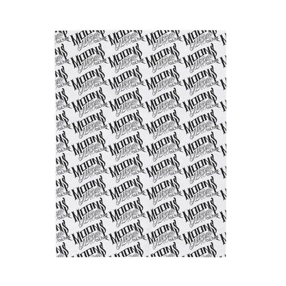 MOONSMC OG Logo plush blanket laid flat, showing diagonal rows of black logos on white fabric.