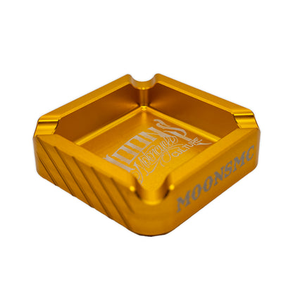 MOONSMC "The Diplomat" Cigar Ashtray: angled top view in gold showing the cigar rests.