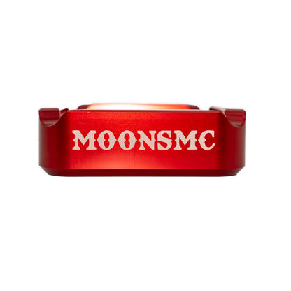 MOONSMC "The Diplomat" Cigar Ashtray: side view of the red tray with MOONSMC lettering.