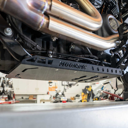 Installed MOONSMC Softail M8 full lower skid plate showing its side rail below the exhaust.