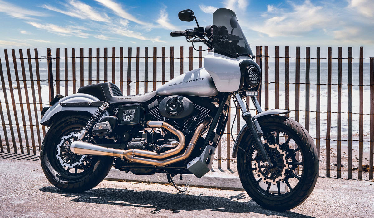 Silver Harley-Davidson Dyna with MOONSMC LED lighting overlooking the ocean