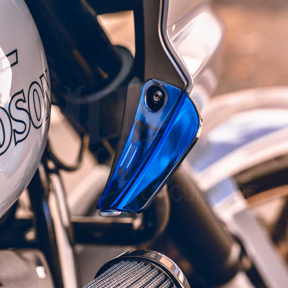 Close-up of a blue MOONSMC air deflector installed on a Softail FXLRST fairing.