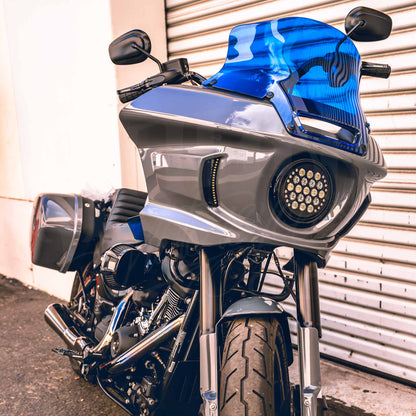 Blue MOONSMC air deflectors and windshield installed on a gray Softail FXLRST fairing.