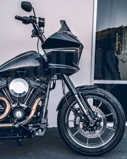 Side view of a motorcycle fitted with a black MOONSMC FXLRST-style fairing.