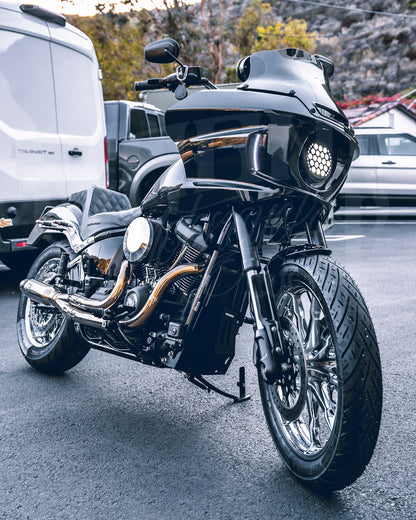 Front three-quarter view of a motorcycle fitted with a black MOONSMC FXLRST-style fairing.