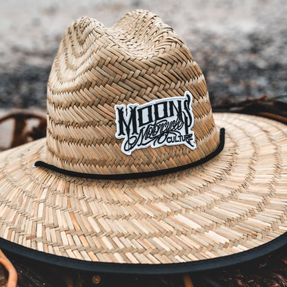 MOONSMC OG Logo UPF 50+ Lifeguard Straw Hat: close-up of the straw hat crown and logo patch.