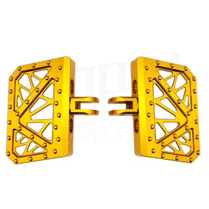 Pair of gold MOONSMC Softail M8 mini floorboards with geometric cutouts and traction pins.