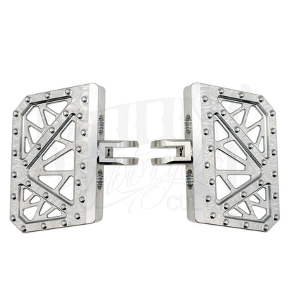 Pair of silver MOONSMC Softail M8 mini floorboards with geometric cutouts and traction pins.