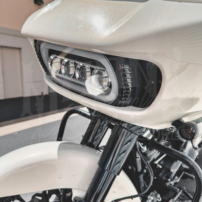Close-up of the MOONSMC Moonmaker 3 headlight installed in a white Road Glide fairing.