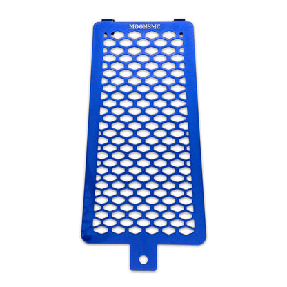 Front view of the blue MOONSMC Softail M8 oil cooler guard with a honeycomb pattern.