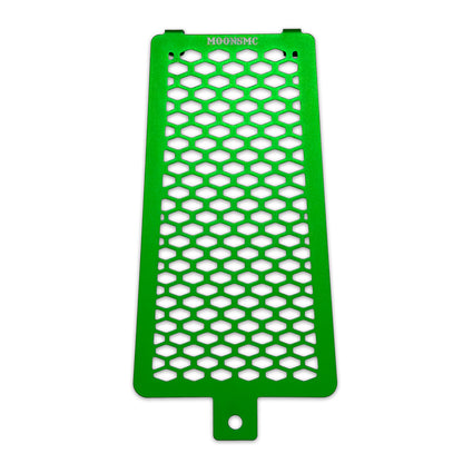 Front view of the green MOONSMC Softail M8 oil cooler guard with a honeycomb pattern.