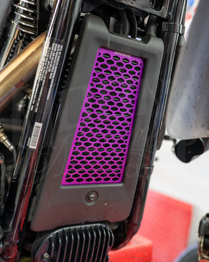 Purple MOONSMC honeycomb oil cooler guard installed at the front of a Softail M8.