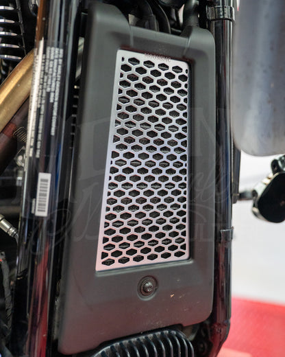 Silver MOONSMC honeycomb oil cooler guard installed at the front of a Softail M8.