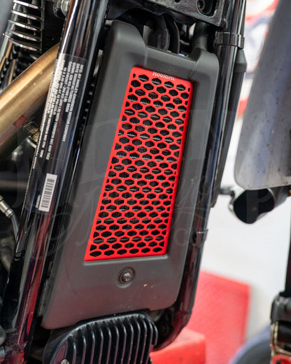 Red MOONSMC honeycomb oil cooler guard installed at the front of a Softail M8.