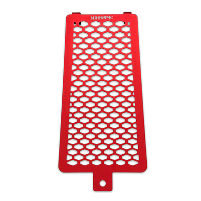 Front view of the red MOONSMC Softail M8 oil cooler guard with a honeycomb pattern.