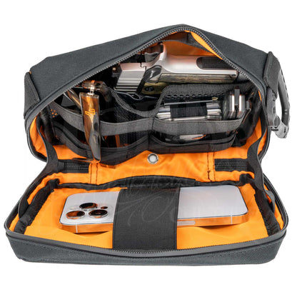 Open MOONSMC UrbanOps handlebar bag showing an orange-lined interior with a phone and small gear secured inside.