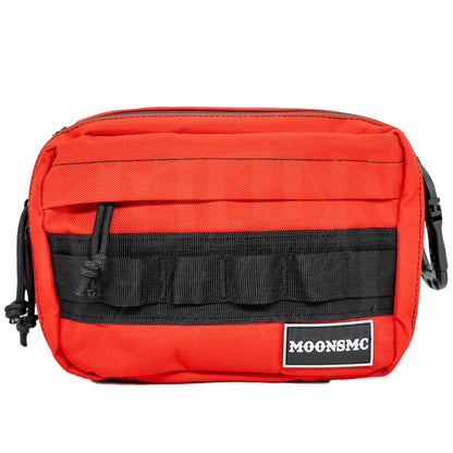 Front view of the red MOONSMC UrbanOps handlebar bag with MOLLE loops and a logo patch.