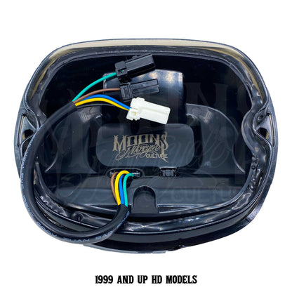 Rear view of V4 tail light plugs and wiring labeled for 1999-and-newer Harley models.