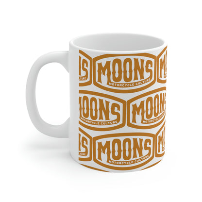 MOONSMC Vintage Badge Ceramic Mug 11oz: white mug with repeating gold badge logos, handle on the left.