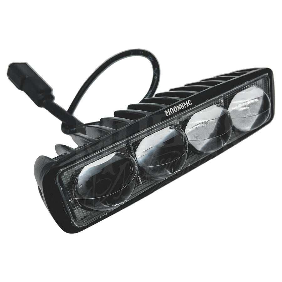 Angled view of the MOONSMC V3 LED light bar with four lenses and its wiring connector.